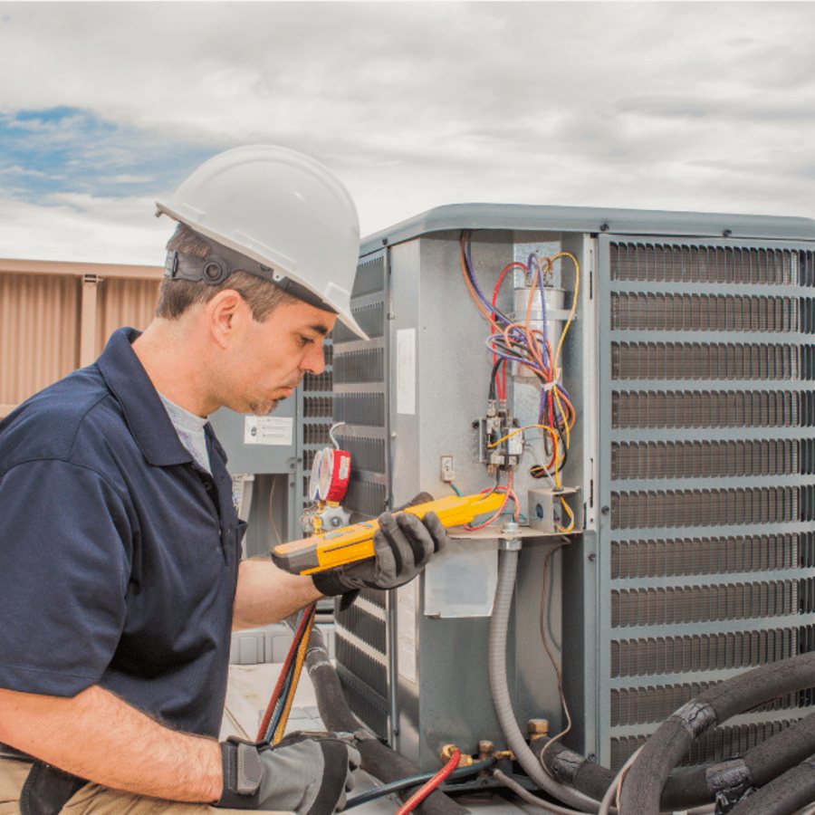 Kitchener AC Repair HVAC technician servicing a system